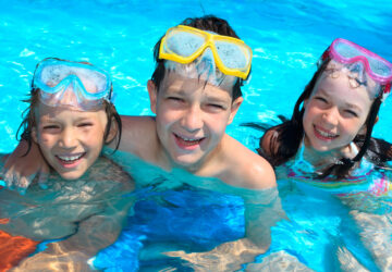 Smiling children in swimming pool