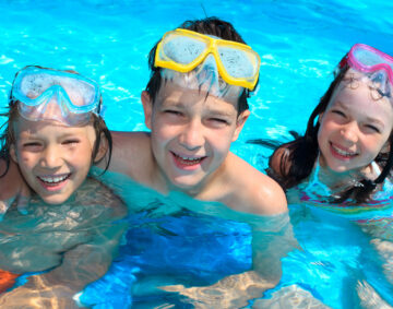 Smiling children in swimming pool