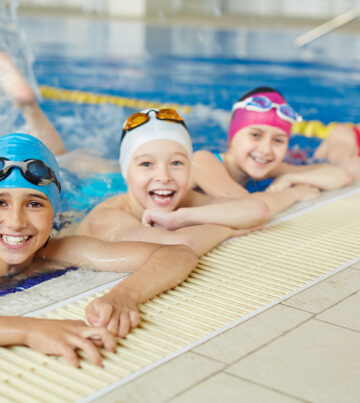 Happy group of children swimming together